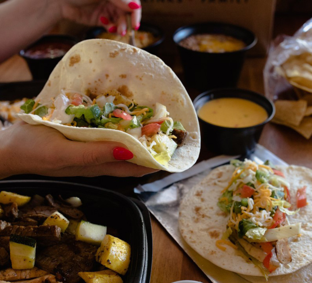 Flour tortilla being held by guest at Abuelo's